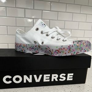 White Converse Chuck Taylors with confetti inside. Low sneakers.
